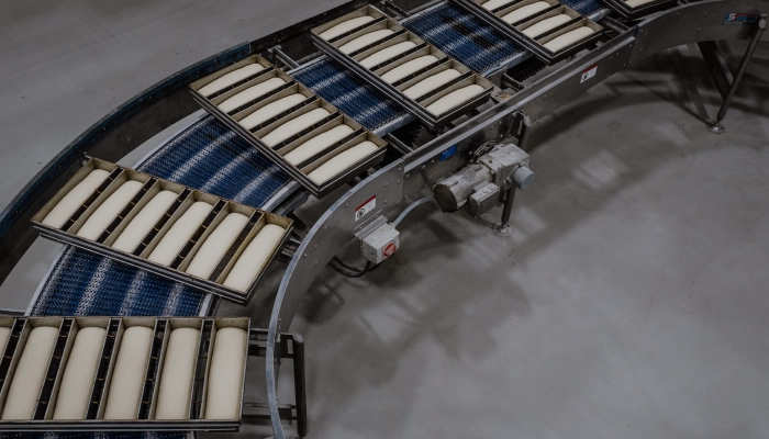 Industrial bread pans on bakery line